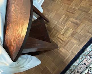 Vintage Drop Leaf Table - A charming vintage drop leaf table in dark wood finish, perfect for small spaces.