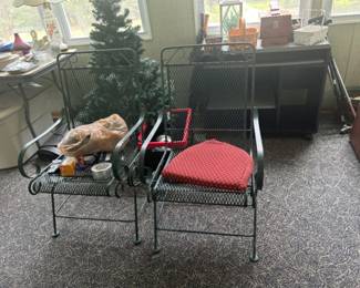 Pair of Metal Patio Chairs with Cushions - This is a pair of sturdy metal patio chairs featuring comfortable red cushions. Ideal for outdoor or indoor seating.