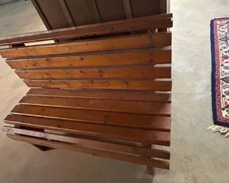 Wooden Slatted Bench - A rustic wooden slatted bench, perfect for indoor or outdoor use. Sturdy construction with a natural finish.