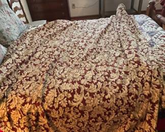 Elegant Floral Patterned Fabric - This beautiful table cover and curtain set was sewn by hand. The fabric features an intricate floral design in rich burgundy and cream tones, perfect for upholstery or crafting.