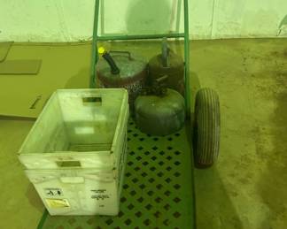 Utility Cart with Gas Cans and Storage Bin - A sturdy utility cart featuring two gas cans and a plastic storage bin. Ideal for outdoor or workshop use.
