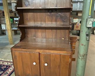 Rustic Wooden Hutch with Shelves and Cabinets - This charming rustic wooden hutch features open shelves and two cabinet doors, perfect for displaying dishes or decor. Ideal for a farmhouse or country-style kitchen.