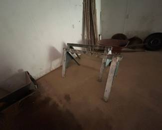 Vintage Wooden Sawhorse - Sturdy vintage wooden sawhorse ideal for woodworking projects or as a display stand. Features a rustic finish with some wear.