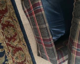 Plaid Upholstered Armchair - A cozy plaid upholstered armchair featuring a classic design. Ideal for adding a touch of comfort to any living space.