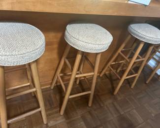 Set of 3 Wooden Bar Stools with Cushioned Seats - This set includes three wooden bar stools featuring comfortable cushioned seats. Perfect for kitchen or bar areas.