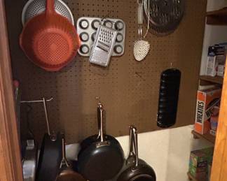 Assorted Kitchenware Set - A collection of kitchen items including pots, a colander, grater, and baking tray. Perfect for any home chef.