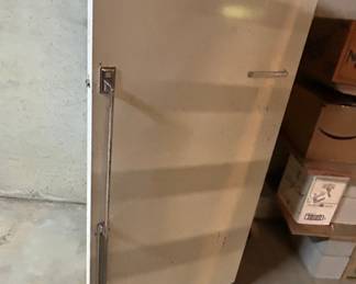 Vintage White Refrigerator - A vintage white refrigerator with a sleek design, perfect for retro kitchens or as a unique storage solution. It features a stainless steel handle and is in good condition.