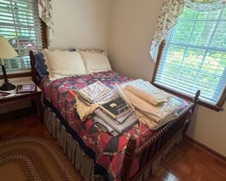 Quilted Bedspread with Pillows - A cozy quilted bedspread featuring a patchwork design, accompanied by two pillows. Perfect for adding warmth and style to any bedroom.