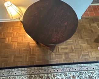 Round Wooden Side Table - A stylish round wooden side table with a rich finish, perfect for any living space.