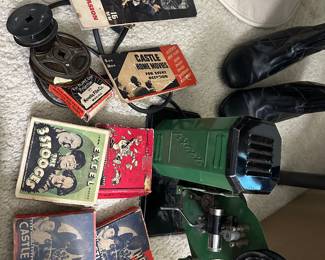 Antique Excel movie projector with movies Three Stooges