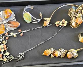 Assorted jewelry, including amber brooch and ring/cuff/necklace set