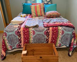 Bed and lots of nice bedding