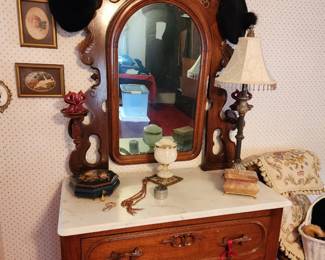 19th Century Victorian Walnut Marble Top Dresser with Ornate Pivoting Mirror w/Side Candle Shelves.