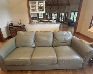 Sage green leather sofa, three-cushion, rolled arms