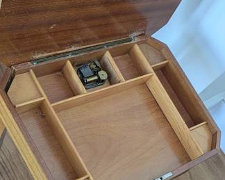 End table opens to music box and storage inside.