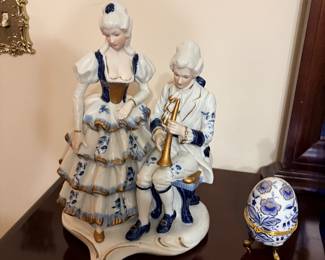 porcelain figurine set by SEI Worldwide features a musical man and woman in a Victorian style with blue and gold trim