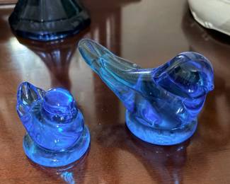 vintage blue glass birds are "Bluebird of Happiness" figurines originally produced by Terra Studios