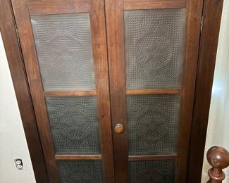 pie safe featuring punched tin panels with a distinctive star motif
