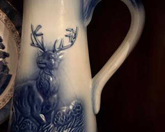 Victoria Ironstone pitcher featuring a 3D molded cobalt blue stag or deer scene
