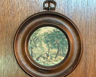 The frames contain circular printed art scenes Currier & Ives collection