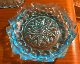 vintage Moon and Star pattern glass ashtray, produced in an aqua blue color by L.E. Smith or L.G. Wright around the late 1960s