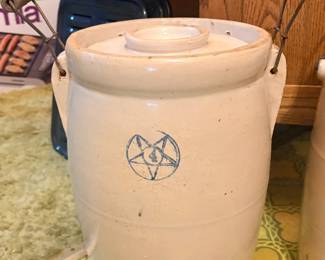 Louisville Pottery Co. stoneware butter churn featuring a blue star stamp