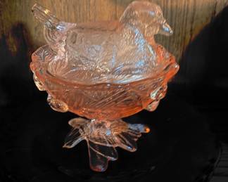 pink footed "Hen on Nest" (HON), a classic collectible glassware piece often used as a candy or trinket dish