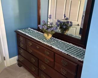 Bedroom dresser with mirror.