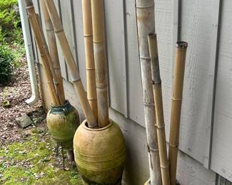 More handmade pots in metal stands with bamboo