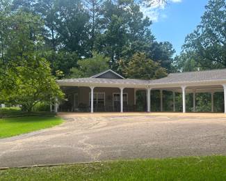 The Pool House is connected to the carport