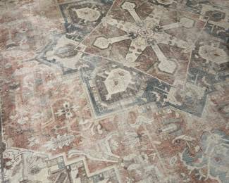 There are 2 of these muted rugs!