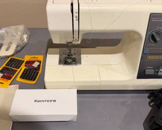 Kenmore model 385 sewing machine with accessories