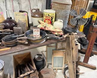 Grizwold and Wagner skillets, washboards, antique fan, cowbell and more.