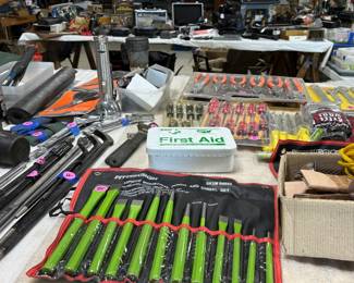 Small hand tools, many in unopened packages.
