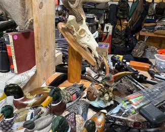 Decorative ducks and skull with antlers.