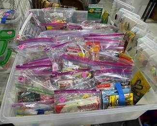 One of several tubs of fishing lures and small items