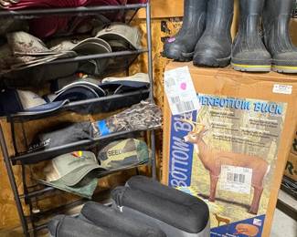 Tons of ball caps, several pairs of muck boots, and deer decoy