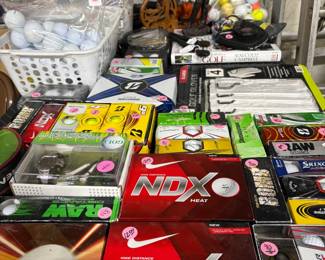 A table full of NIB golf balls
