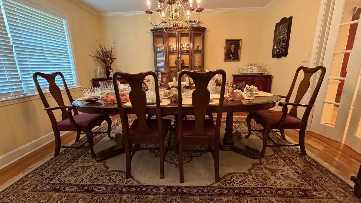 Wide-angle view of dining room featuring Ethan Allen furniture.