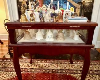 Display end table featuring bells.