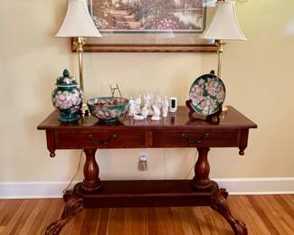 View of entry foyer featuring mahogany console.