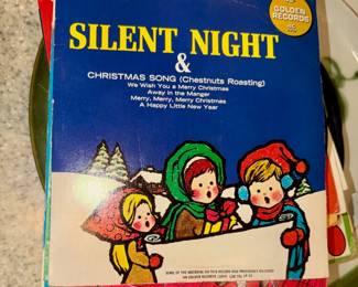 Vintage Christmas vinyl records (45s).