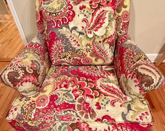 One of a pair of Paula Deen bright paisley upholstered arm chairs.