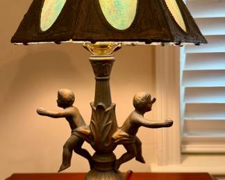 Cherub lamp with blue slag glass.