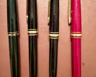 Collection of MontBlanc fountain and ball point pens.