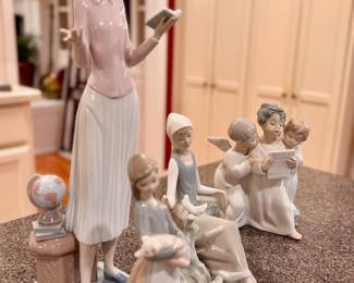Several Lladro figurines.