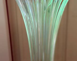 Fenton swung glass vase under UV light.