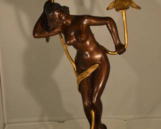 The Second in a Pair of Bronze and Gilt Gold Nude Candlesticks