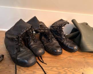 Military leather combat boots and rubber overshoes