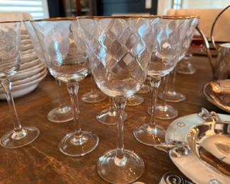 Gold-rimmed crystal wine glasses